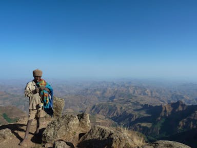 Boy in front of Simien Mountains landscape